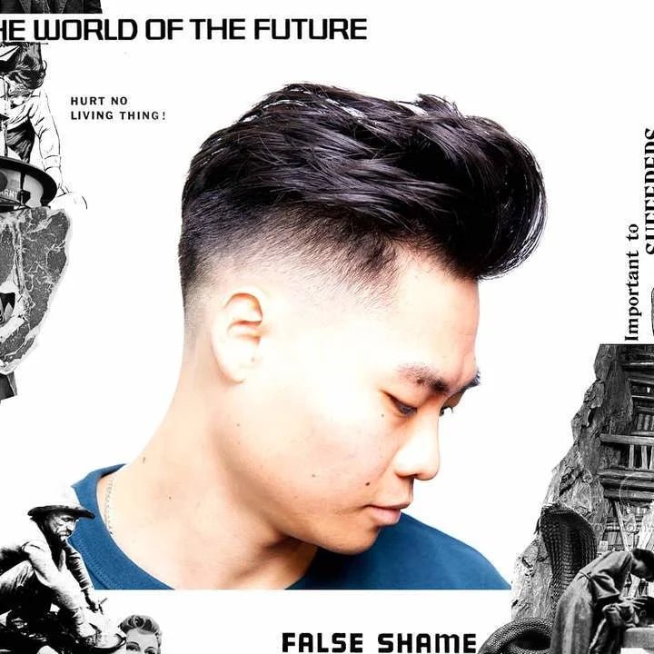 A man with a modern fade looks down, hair styled with Clay by Uppercut Deluxe for strong hold, set against black-and-white collages and bold text: “THE WORLD OF THE FUTURE” and “FALSE SHAME.”.