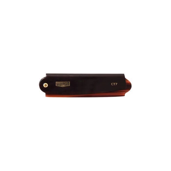 The Uppercut Deluxe CT7 Flip Comb, shown closed with a dark handle and labeled "UPPERCUT" and "CT7," features a fold away design perfect for travel.