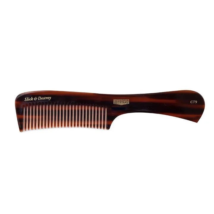 The CT9 Styling Comb by Uppercut Deluxe is a brown tortoiseshell-patterned comb with a handle, ideal for precision styling of medium to long hair. Features “Slick & Destroy” and “Uppercut” printed on the comb.
