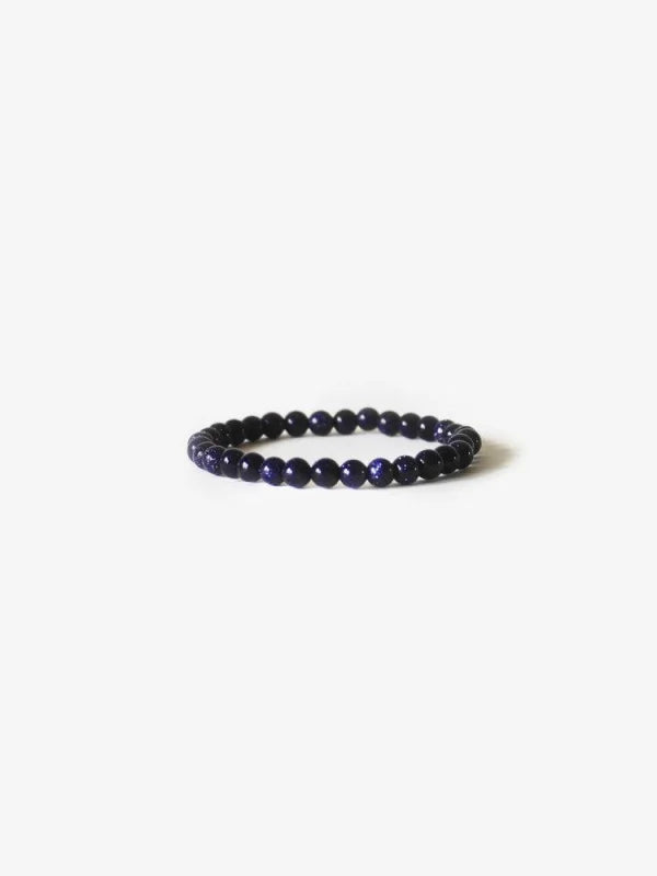 Black Bea Bracelet Displayed In Earth Bracelet | Branco Product, Featuring Blue Lapis For Power & Healing.