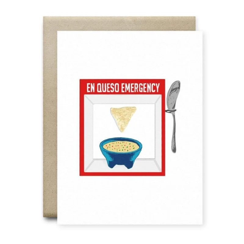 The En Queso Emergency Card by Anvil Cards is an A2 linen paper greeting card featuring a tortilla chip, queso bowl, and spoon with "EN QUESO EMERGENCY" in a red border. Blank inside for your message.
