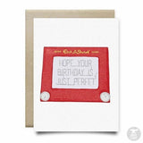 The Etch a Sketch Birthday Card by Anvil Cards is an A2 linen card with a red Etch A Sketch and the message "HOPE YOUR BIRTHDAY IS JUST PERFET" (missing "C"). Blank inside for your own note.