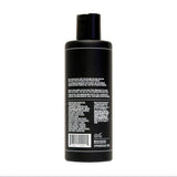 A black plastic bottle of Uppercut Deluxe Everyday Shampoo with a flip-top cap, shown from the back with white printed details—ideal for daily cleansing and prepping hair for styling. Brand: Uppercut Deluxe.