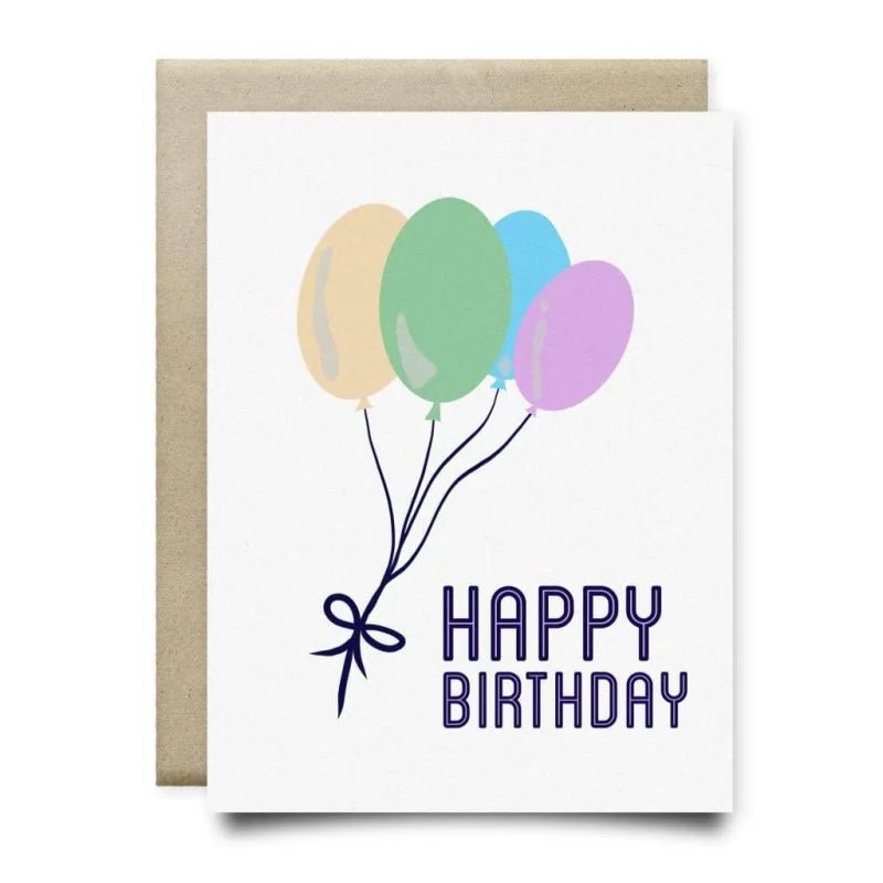 The Fly Away Birthday Card by Anvil Cards is a blank inside A2 linen card with four pastel balloons and "Happy Birthday," paired with a brown envelope.