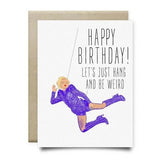 The Gaga Birthday Card by Anvil Cards is A2 size, featuring a person in purple hanging from a string and “Happy Birthday! Let's just hang and be weird.” Printed on linen paper; blank inside for your own message.
