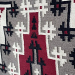 Close-up of the Vintage Ganado Rug Classic "Snowflake" CA 1980, showcasing authentic woven geometric patterns in red, black, grey, and white in the classic Navajo Ganado style.
