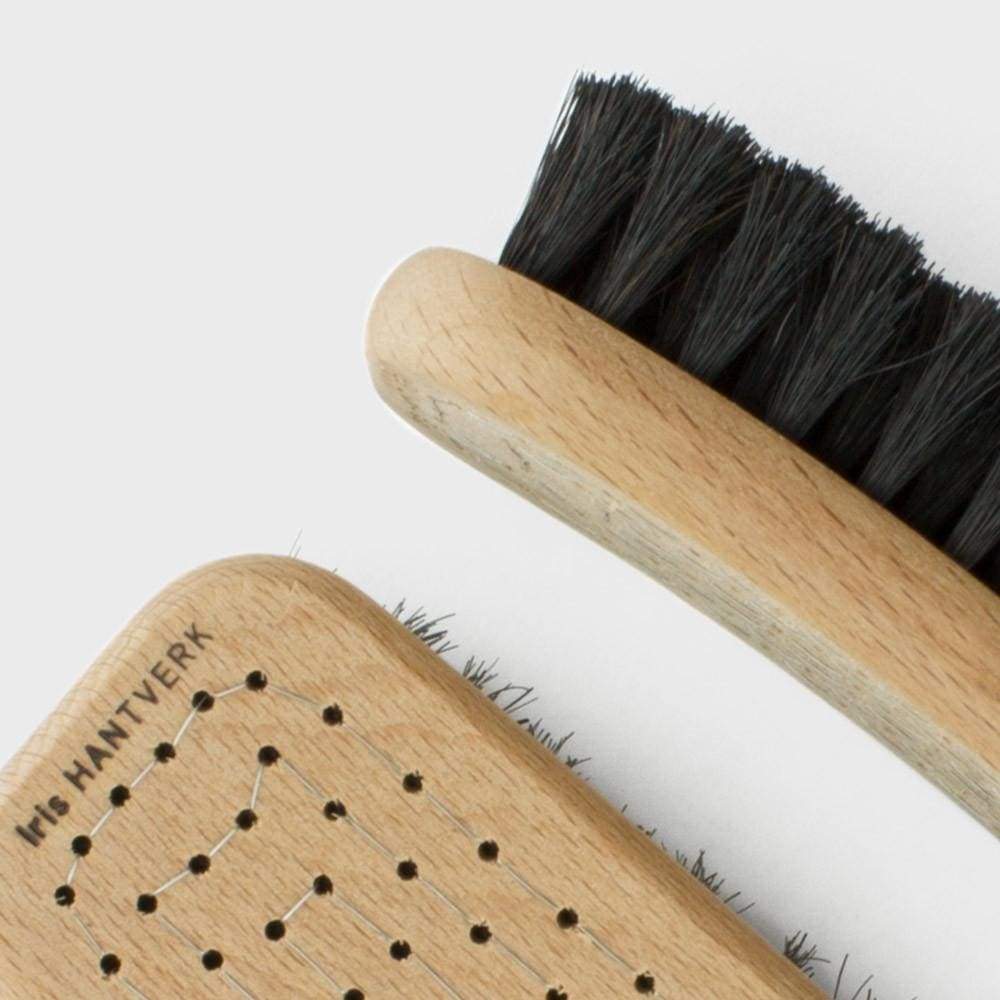 Wooden-handled horsehair shoe brush with dark bristles for premium shoe care