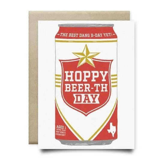 The Hoppy Beerthday Lone Star Card by Anvil Cards features a beer can with "Hoppy Beer-th Day" and a Texas outline on linen paper. This A2 card is blank inside, ideal for personalizing your birthday wishes.