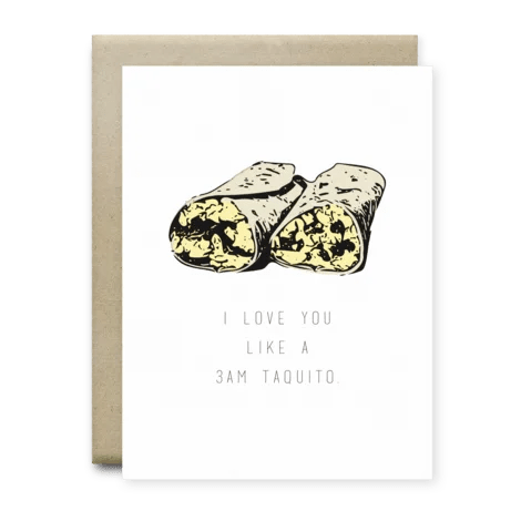 The I Love You Like A 3am Taquito Card from Anvil Cards features two cut taquitos above the phrase, "I love you like a 3AM taquito." This A2 linen card includes a brown envelope and is blank inside for your message.