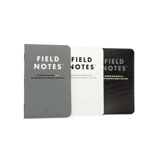 The Ignition | Field Notes pack includes three Field Notes notebooks in gray, white, and black covers, each labeled by type (like 26-Week Planner or checklist journal) with “Made in the U.S.A.” on the front.