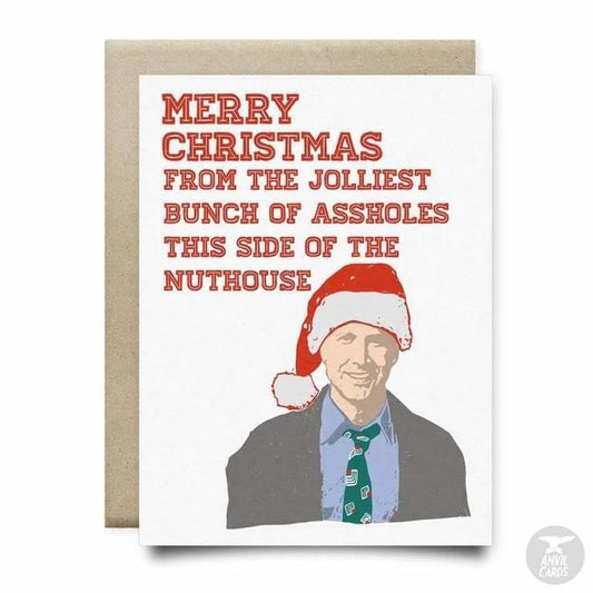Jolliest Bunch of A*Holes Card by Anvil Cards: A holiday A2 greeting card with a man in a Santa hat and suit, featuring "Merry Christmas from the jolliest bunch of assholes this side of the nuthouse." Blank inside, premium linen paper.