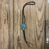 Large turquoise bolo tie with vibrant turquoise stones in vintage style