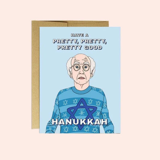 Larry Hanukkah Christmas Card by Party Mountain Paper co. features an older man in a blue Star of David sweater with "Have a pretty, pretty, pretty good Hanukkah." Printed on matte white cardstock. A2 size. Made in Toronto.
