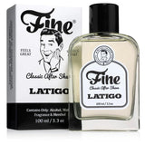 A 100ml bottle and box of Latigo Classic Aftershave by Fine Accoutrements, featuring vintage-style art of a smiling man and a rich leather scent with hints of talc and diesel on both the packaging and label.