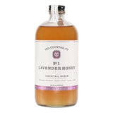 A 16 oz clear glass bottle labeled "Lavender Honey Cocktail Mixer | Yes Cocktail Co." contains a light amber mixer with floral honey notes from Yes Cocktail Co.