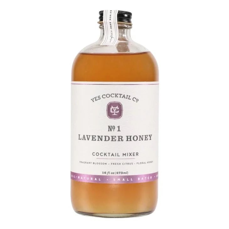 A 16 oz clear glass bottle labeled "Lavender Honey Cocktail Mixer | Yes Cocktail Co." contains a light amber mixer with floral honey notes from Yes Cocktail Co.