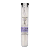 A test tube-shaped container from Yes Cocktail Co. holds Lavender & Lemon Champagne Cocktail Cubes—organic cane sugar cubes infused with bitters, ideal for making a refreshing champagne cocktail or enhancing your next mimosa.
