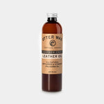 Otter Wax Leather Polishing Oil is an all-natural leather polish and conditioner with safflower and vitamin oils, presented in a 9-ounce brown bottle with a kraft paper label.