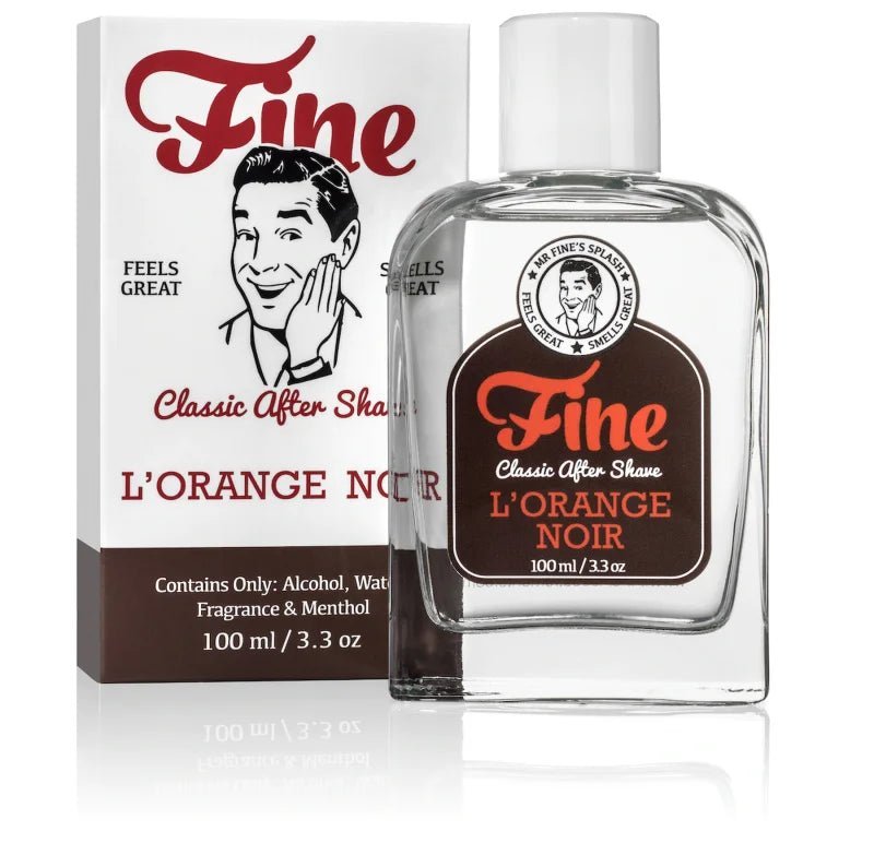 A 100ml bottle of L'Orange Noir Classic Aftershave by Fine Accoutrements, inspired by Terre d'Hermes, is shown beside its box with retro man artwork—ideal for those who appreciate classic aftershave fragrances.
