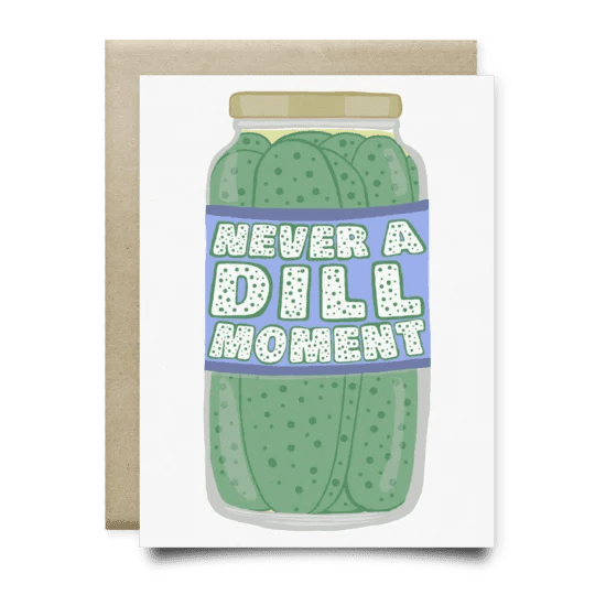 The Never A Dill Moment Card by Anvil Cards features a jar of pickles and the phrase "Never a dill moment." This A2 linen paper greeting card comes blank inside with a matching envelope.