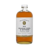 A clear glass bottle of Yes Cocktail Co.’s Orange Peel & Bitters Cocktail Mixer features a crisp white label and metal cap, containing amber liquid that recalls classic old fashioned flavors.