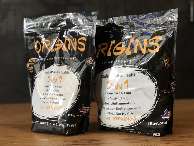 Two bags of Origins Canine Supplement fermentation product from Rogue Pet Feed