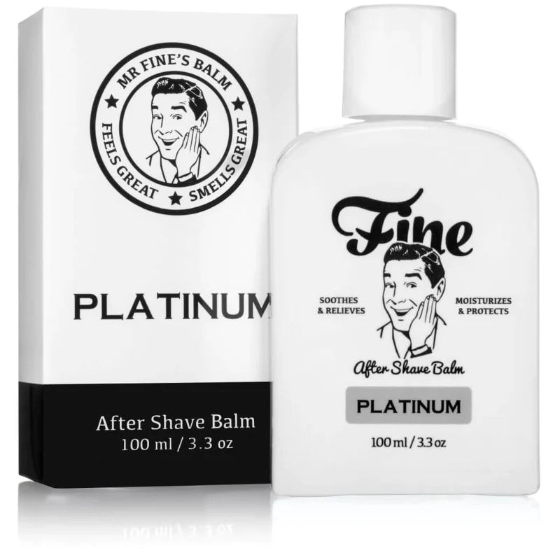 A white bottle and box of Fine Accoutrements Platinum Aftershave Balm, 100ml, features a retro man’s face and black text. Inspired by Creed Aventus, this alcohol-free balm soothes and refreshes post-shave skin.