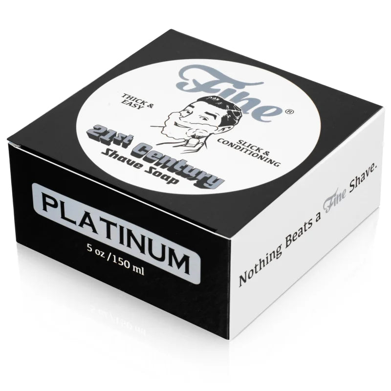 A 5 oz box of Fine Accoutrements Platinum Shaving Soap, 21st Century scent, comes in sleek black, white, and silver packaging with branding—crafted for an authentic barbershop shave.