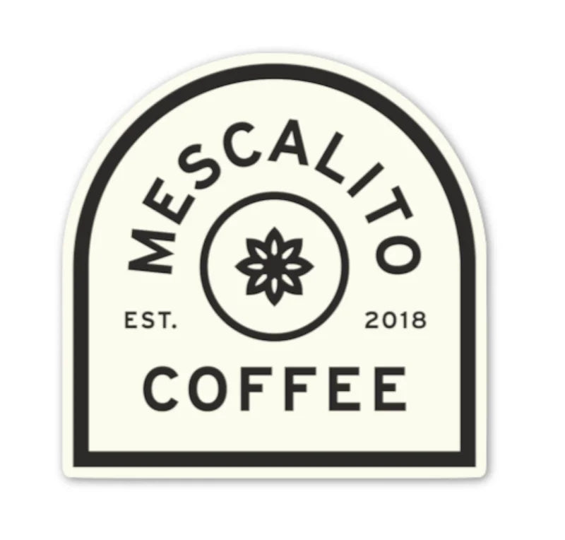Mescalito Coffee’s Shop Stickers feature their black and white logo with a central stylized flower—ideal for small town coffee shop merchandise or unique coffee shop designs. Established in 2018.
