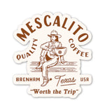 The Shop Stickers from Mescalito Coffee feature a cowboy with a coffee mug and "Mescalito Quality Coffee, Brenham Texas USA, Worth the Trip"—a charming pick for small town coffee lovers.