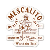 Shop Stickers | Mescalito Coffee feature a cowboy with a coffee mug and the text “Mescalito Quality Coffee, Brenham Texas USA, ‘Worth the Trip.’” by Mescalito Coffee—perfect for small town coffee shop vibes and merchandise.