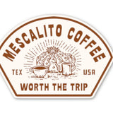 The Shop Stickers from Mescalito Coffee display a brown and white logo with a cactus, coffee cups, “Tex USA,” and the slogan “Worth the Trip”—ideal for adding small town charm to any coffee shop.
