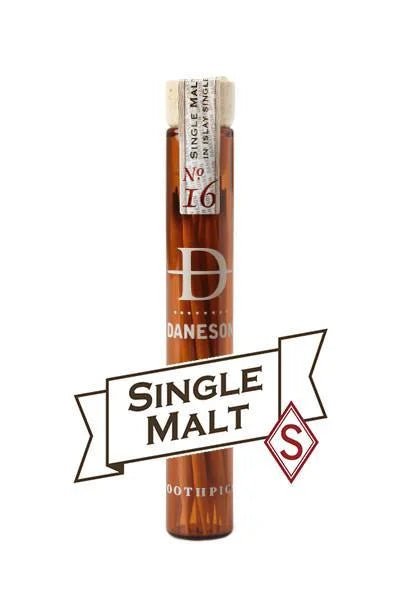 A glass vial labeled "Daneson Toothpick | Single Malt No. 16" contains whisky-infused toothpicks; the packaging features a cork stopper, Daneson's logo, and evokes the smoky spirit of Islay.