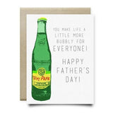 The Topo Chico Father's Day Card by Anvil Cards is an A2 linen paper card featuring a green glass bottle labeled "To my Papa" with the message, "You make life a little more bubbly for everyone! Happy Father's Day!" Blank inside.