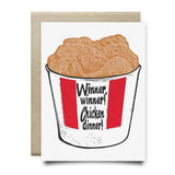 The Winner Winner Chicken Dinner Card by Anvil Cards features a fried chicken bucket with "Winner, winner! Chicken dinner!" on A2 linen paper. Blank inside for your message and paired with a brown envelope.